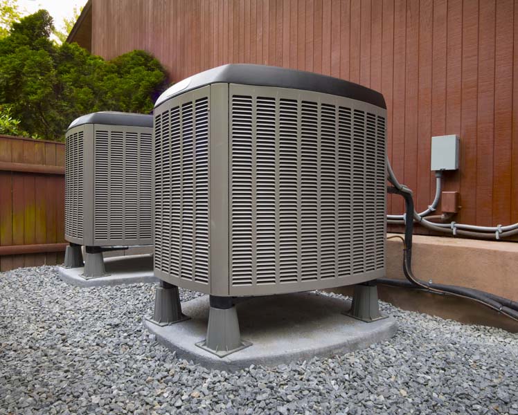 air conditioning units on side of building showing how an air conditioner works